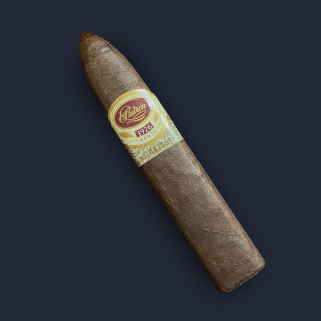 A Padrón Serie 1926 No. 2 belicoso with a gold and cream band, its tapered head resting against a dark navy backdrop.