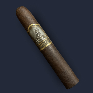 A Foundation Tabernacle Toro in Connecticut Broadleaf wrapper, banded in cream and gold with an embossed figure.